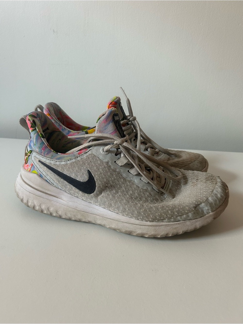 Nike Women's Light Gray Sneakers with Black Swoosh and Floral Lining
